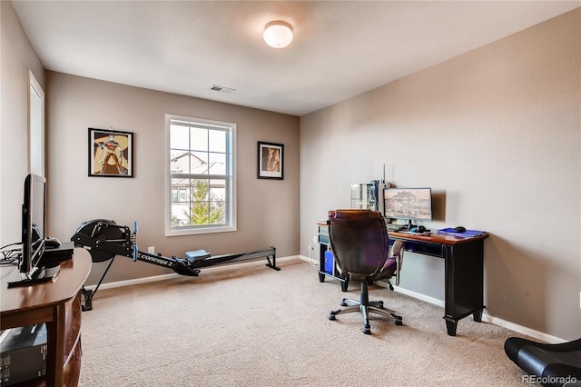 office area with carpet flooring, baseboards, and visible vents