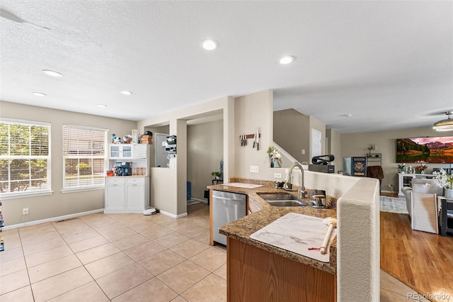 2695 E 109th Ave, Northglenn, CO 80233 - kitchen with dishwasher, light tile patterned floors, recessed lighting, open floor plan, and stone countertops