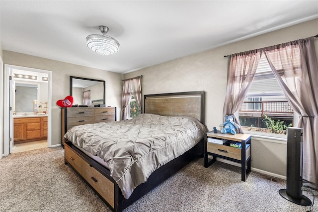 2695 E 109th Ave, Northglenn, CO 80233 - bedroom with light colored carpet and ensuite bathroom