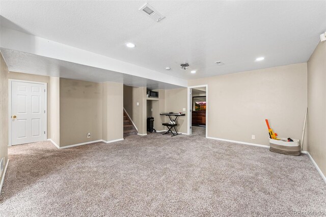 2695 E 109th Ave, Northglenn, CO 80233 - finished below grade area featuring carpet, stairway, and recessed lighting