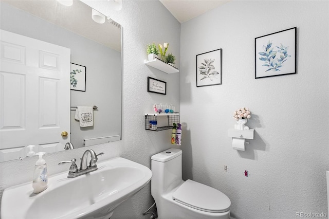 2695 E 109th Ave, Northglenn, CO 80233 - half bath with a sink and a textured wall