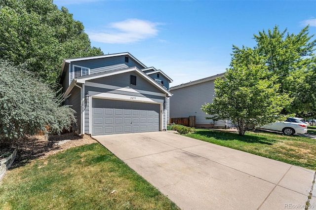 2695 E 109th Ave, Northglenn, CO 80233 - view of front of home with concrete driveway, a front yard, and an attached garage