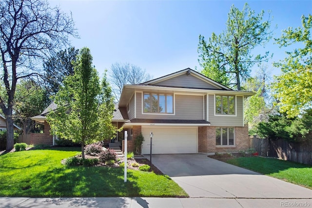 view of front of home with a garage, brick siding, and driveway