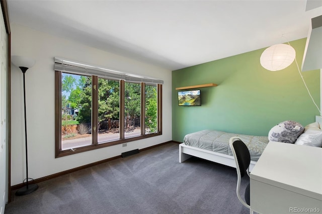 carpeted bedroom with baseboards