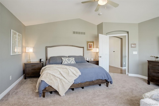 bedroom featuring visible vents, baseboards, and light colored carpet