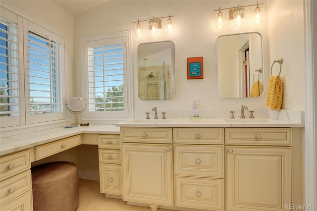 full bath with double vanity, tile patterned floors, walk in shower, and a sink