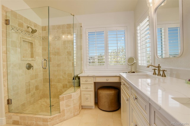 full bathroom with tile patterned floors, a shower stall, and vanity