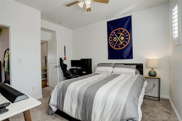 bedroom featuring a ceiling fan, baseboards, and carpet