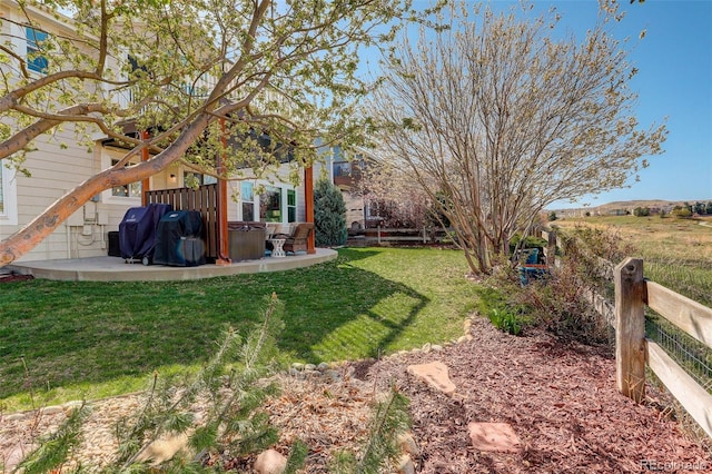 view of yard featuring a patio and fence