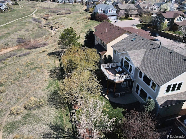 birds eye view of property with a residential view