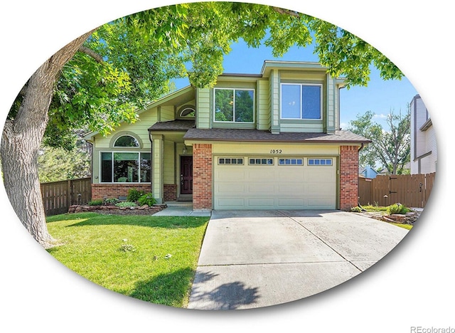 1052 Northampton Ct, Highlands Ranch, CO 80126 - view of front of house featuring brick siding, concrete driveway, and a garage