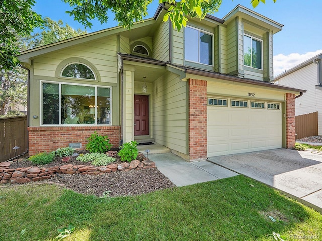 1052 Northampton Ct, Highlands Ranch, CO 80126 - view of front of home with concrete driveway, an attached garage, and brick siding