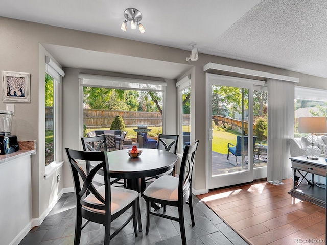 1052 Northampton Ct, Highlands Ranch, CO 80126 - dining space with healthy amount of natural light and a textured ceiling