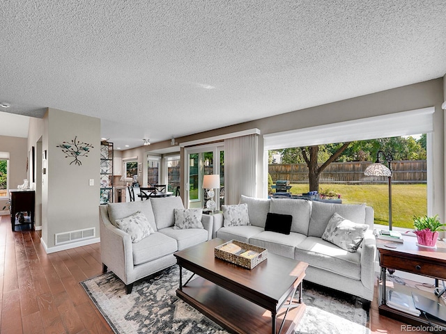 1052 Northampton Ct, Highlands Ranch, CO 80126 - living area featuring a textured ceiling and wood finished floors