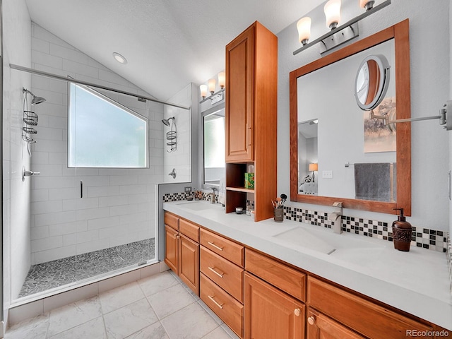 1052 Northampton Ct, Highlands Ranch, CO 80126 - bathroom featuring vaulted ceiling, decorative backsplash, a shower stall, and double vanity
