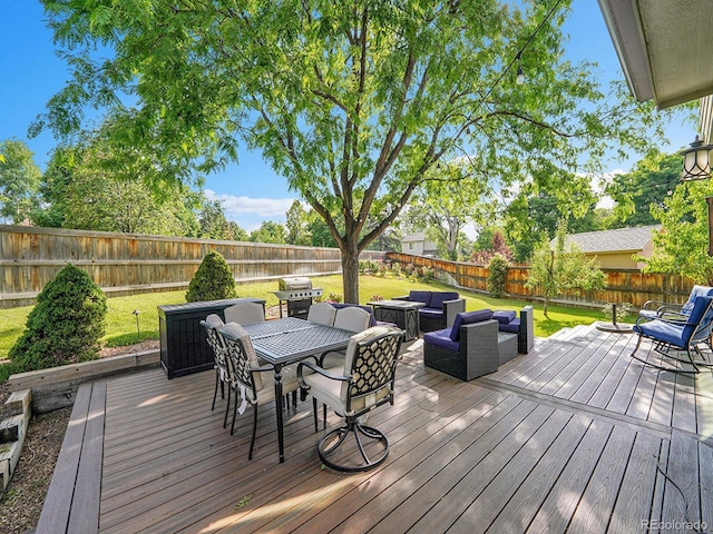 1052 Northampton Ct, Highlands Ranch, CO 80126 - wooden deck with an outdoor living space, a fenced backyard, and outdoor dining area