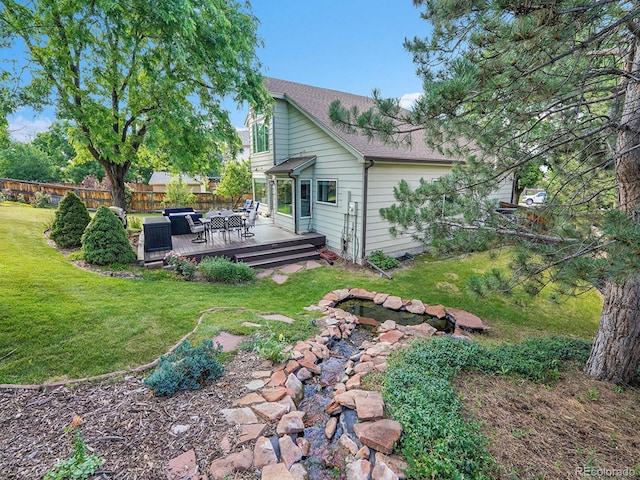 1052 Northampton Ct, Highlands Ranch, CO 80126 - back of property featuring a wooden deck and a shingled roof