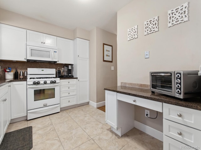 kitchen featuring white appliances, a toaster, decorative backsplash, and white cabinets