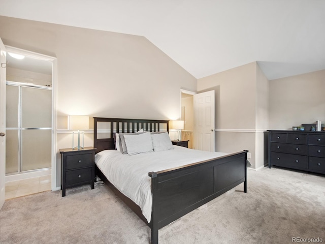 carpeted bedroom with lofted ceiling