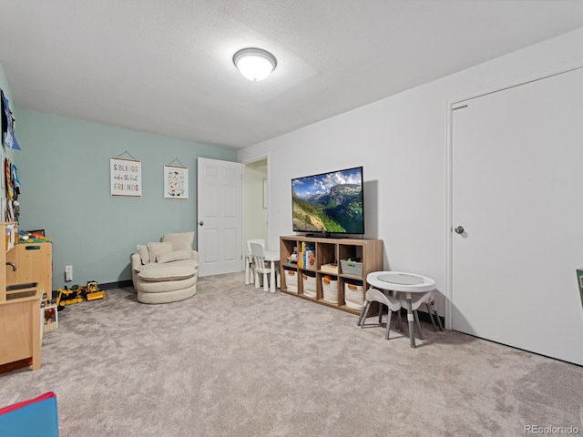 interior space featuring carpet floors and a textured ceiling