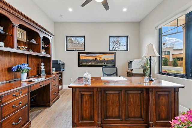 office space with recessed lighting, baseboards, light wood-style floors, and a ceiling fan