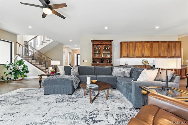 living area featuring stairway, recessed lighting, ceiling fan, and wood finished floors