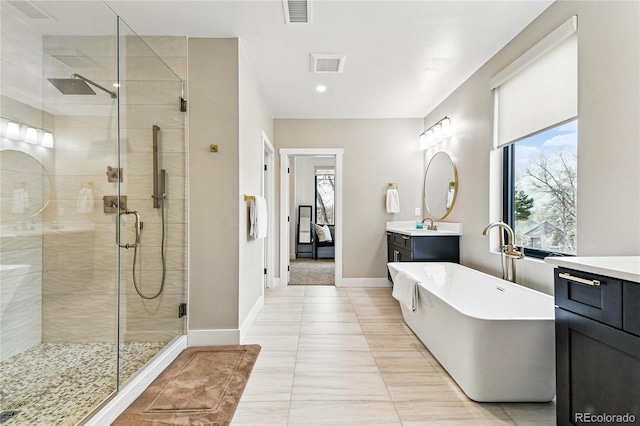 full bath featuring visible vents, a stall shower, and vanity