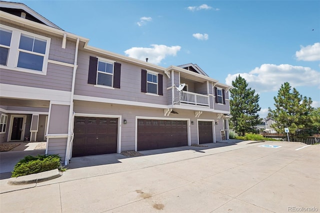 17145 Waterhouse Cir Unit F, Parker, CO 80134 - view of front of home featuring an attached garage, a balcony, and concrete driveway
