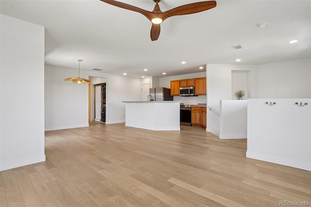17145 Waterhouse Cir Unit F, Parker, CO 80134 - unfurnished living room featuring recessed lighting, light wood-style floors, and a ceiling fan
