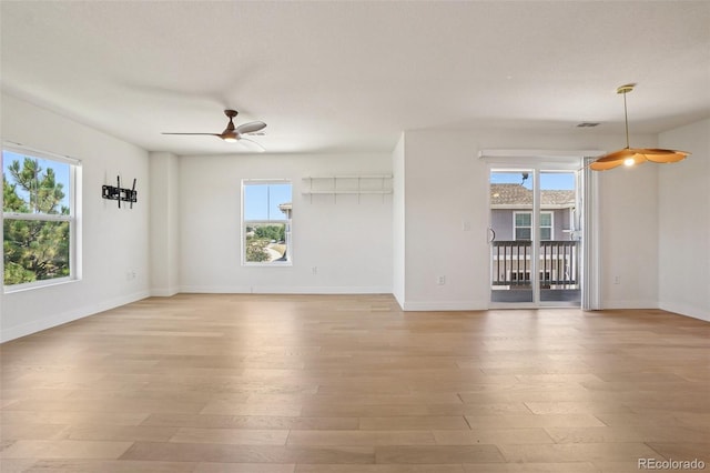 17145 Waterhouse Cir Unit F, Parker, CO 80134 - spare room with healthy amount of natural light, ceiling fan, and light wood-type flooring