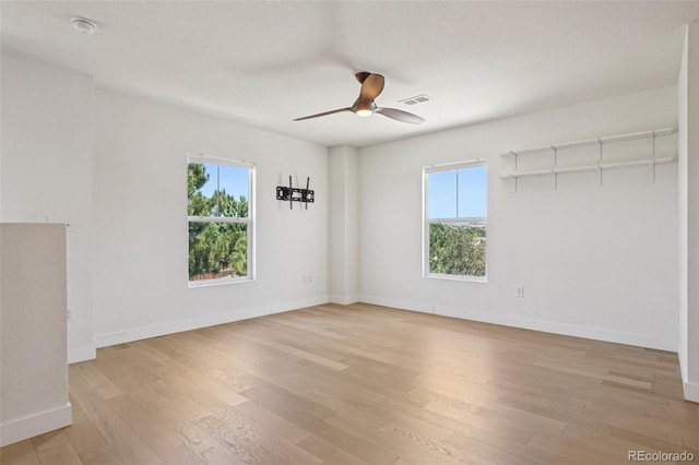 17145 Waterhouse Cir Unit F, Parker, CO 80134 - empty room featuring light wood-style floors, a ceiling fan, and a smoke detector