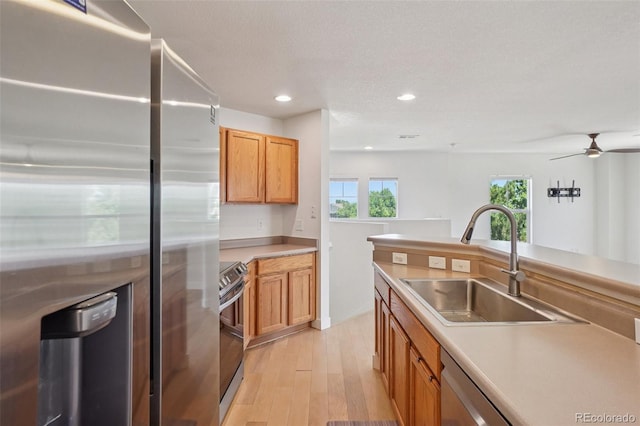 17145 Waterhouse Cir Unit F, Parker, CO 80134 - kitchen featuring stainless steel appliances, light wood-style flooring, recessed lighting, light countertops, and ceiling fan
