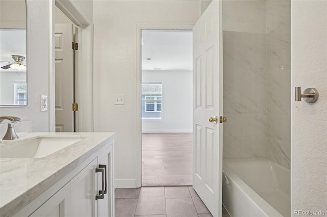 17145 Waterhouse Cir Unit F, Parker, CO 80134 - bathroom featuring vanity, a ceiling fan, tile patterned flooring, and bathing tub / shower combination