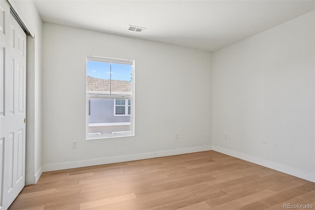 17145 Waterhouse Cir Unit F, Parker, CO 80134 - unfurnished bedroom with light wood finished floors and a closet