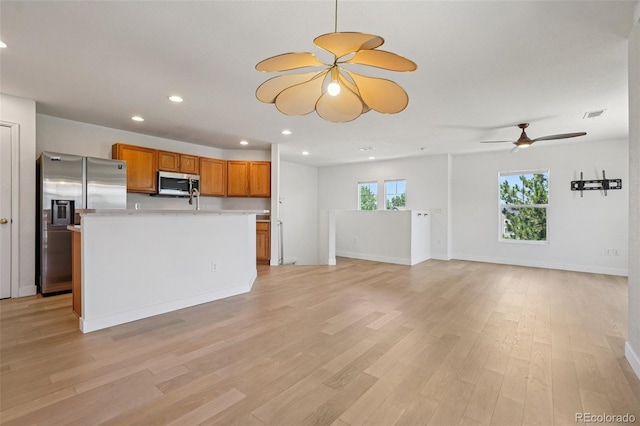 17145 Waterhouse Cir Unit F, Parker, CO 80134 - unfurnished living room featuring ceiling fan, light wood-type flooring, and recessed lighting