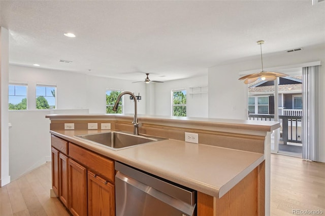 17145 Waterhouse Cir Unit F, Parker, CO 80134 - kitchen featuring a ceiling fan, stainless steel dishwasher, an island with sink, healthy amount of natural light, and recessed lighting