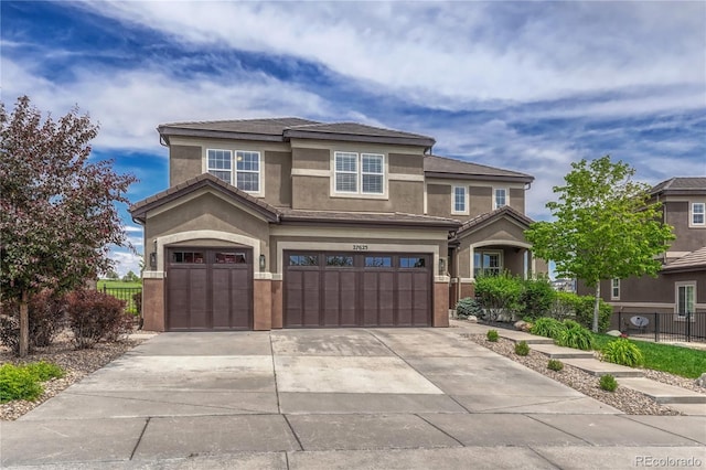 27625 E Moraine Dr, Aurora, CO 80016 - view of front facade with a garage, concrete driveway, and stucco siding