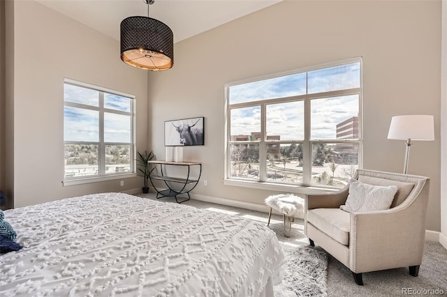 carpeted bedroom with baseboards