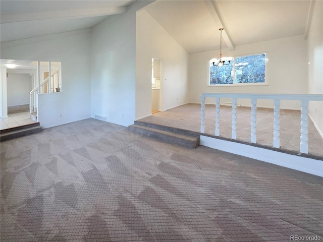 spare room with visible vents, vaulted ceiling with beams, carpet, a chandelier, and stairs