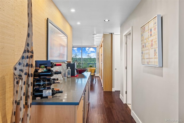 4570 E Yale Ave Unit 1104, Denver, CO 80222 - kitchen with expansive windows, dark wood-type flooring, recessed lighting, and baseboards