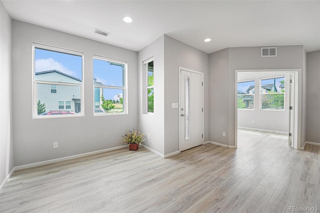 4760 Kittredge St, Denver, CO 80239 - foyer with light wood-type flooring, baseboards, and recessed lighting