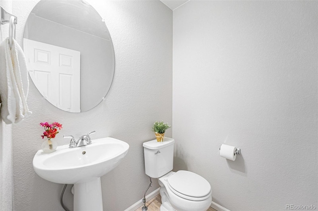 4760 Kittredge St, Denver, CO 80239 - bathroom featuring toilet and baseboards