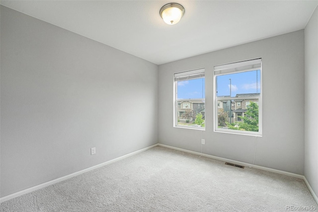 4760 Kittredge St, Denver, CO 80239 - carpeted spare room featuring baseboards