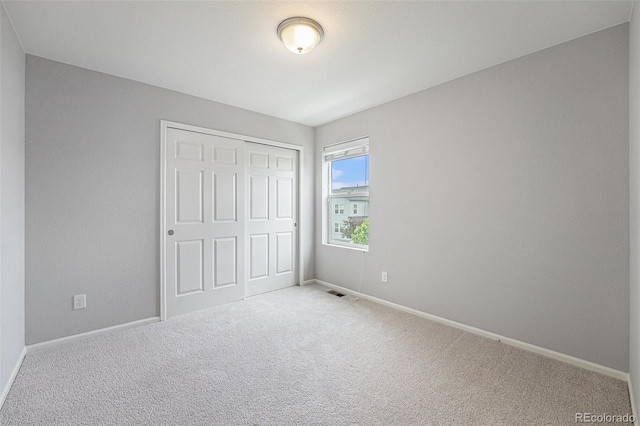 4760 Kittredge St, Denver, CO 80239 - unfurnished bedroom with carpet floors, baseboards, and a closet