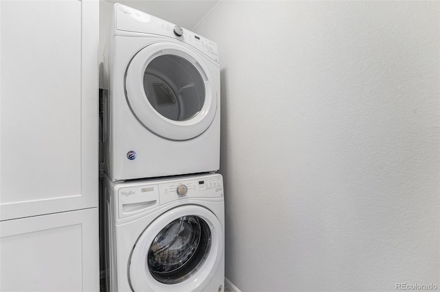 4760 Kittredge St, Denver, CO 80239 - washroom featuring stacked washer and clothes dryer