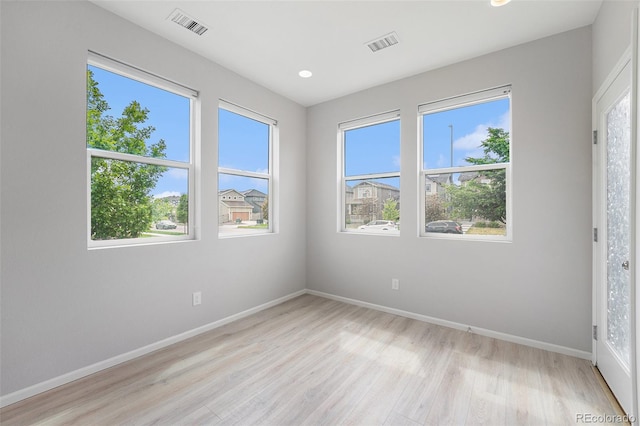 4760 Kittredge St, Denver, CO 80239 - spare room with light wood-style flooring, baseboards, and recessed lighting