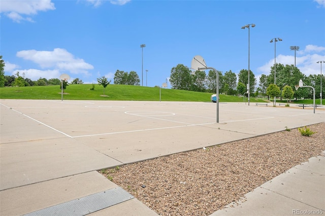 4760 Kittredge St, Denver, CO 80239 - view of property's community with community basketball court and a lawn