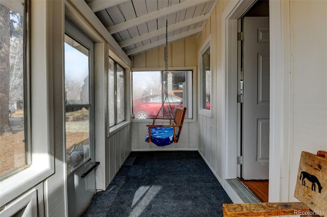 sunroom featuring wood ceiling and vaulted ceiling with beams