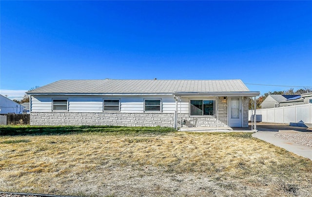 ranch-style house with a front lawn