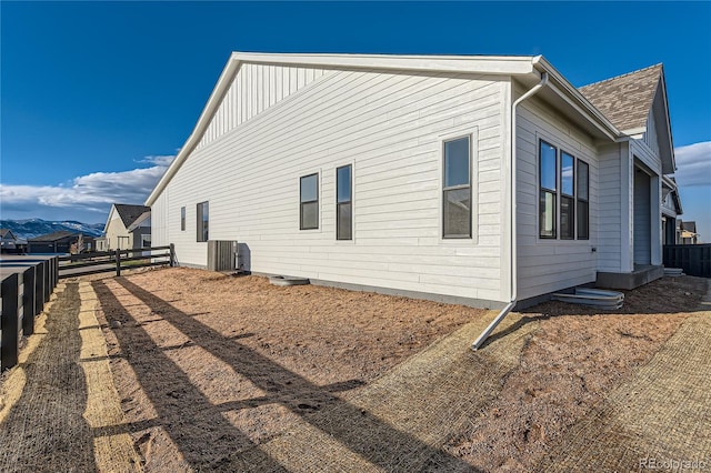 view of side of home with a mountain view